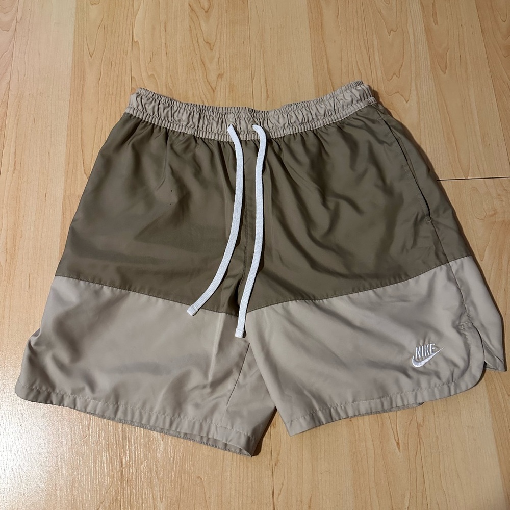 Nike Beige Athletic Shorts with White Logo Tag